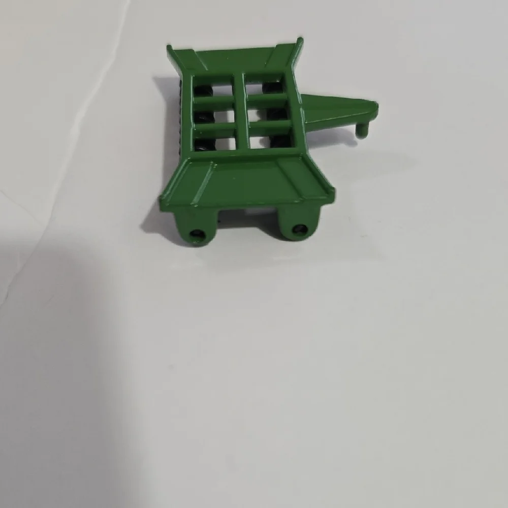 Toy John Deere combine corn head, likely an Ertl 1/64 scale model.